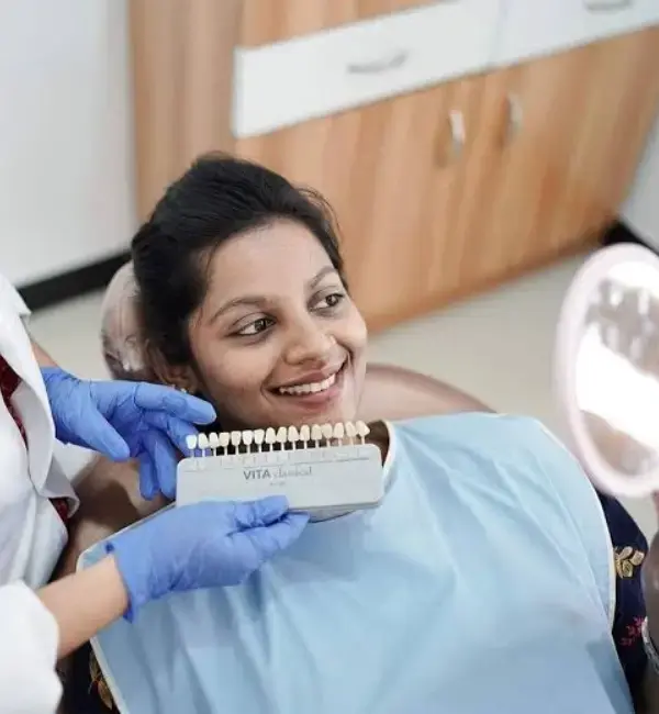 Dentist matching tooth shade accurately